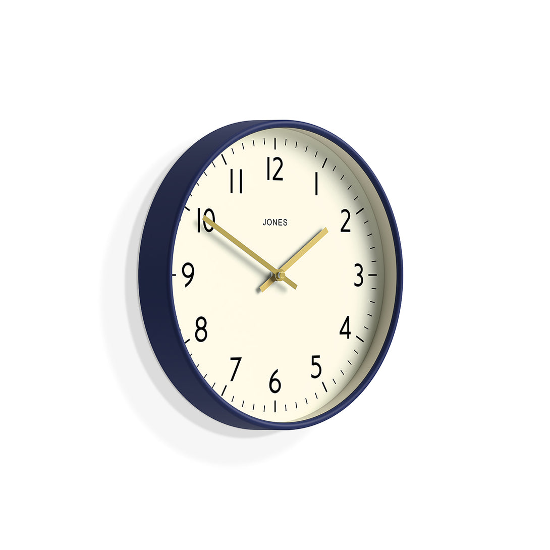 Skew - Studio wall clock by Jones Clocks in midnight blue with an easy-to-read and minimalistic dial an gold effect hands - JPEN52PEBL