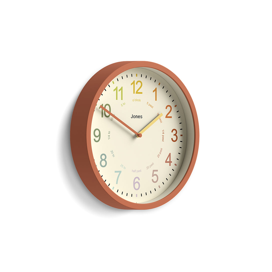 Side view of Kids wall clock by Jones Clocks in terracotta orange with a multi-coloured, easy-to-read dial - JDRAG180TO
