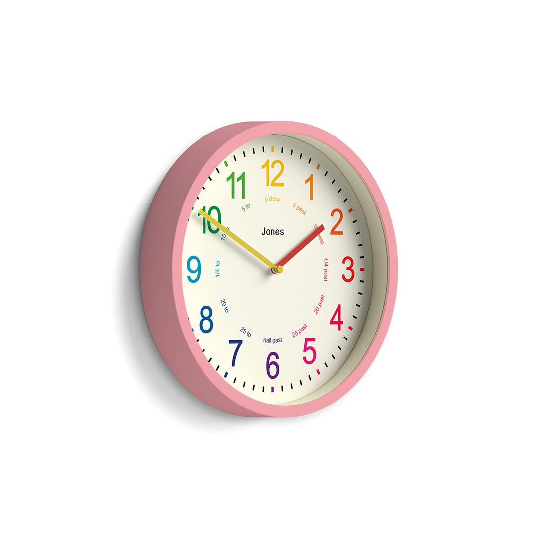 Side view - Kids wall clock by Jones Clocks in pink with a multi-coloured, easy-to-read dial - JDRAG73MPK