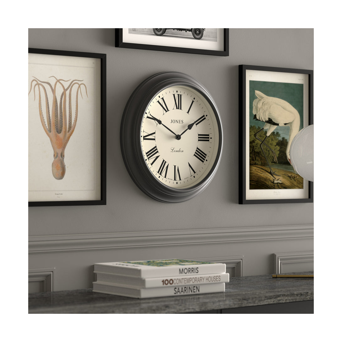 Gallery wall skew - Large Supper Club wall clock by Jones Clocks. A classic Dark Grey case with a Roman Numeral dial and black spade hands - JSUP319GGY
