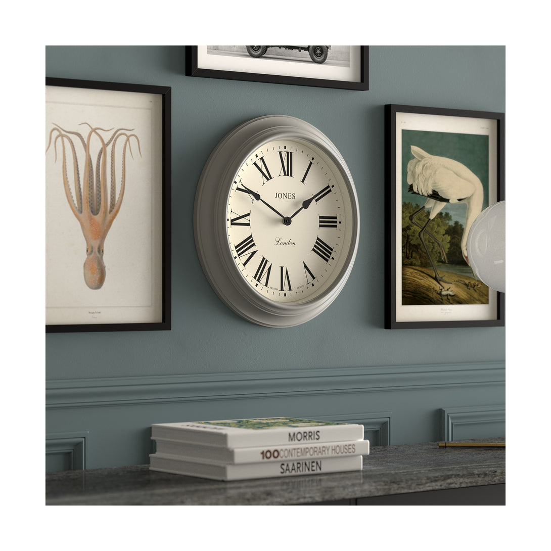 Gallery wall skew - Large Supper Club wall clock by Jones Clocks. A classic grey case with a Roman Numeral dial and black spade hands - JSUP319PGY