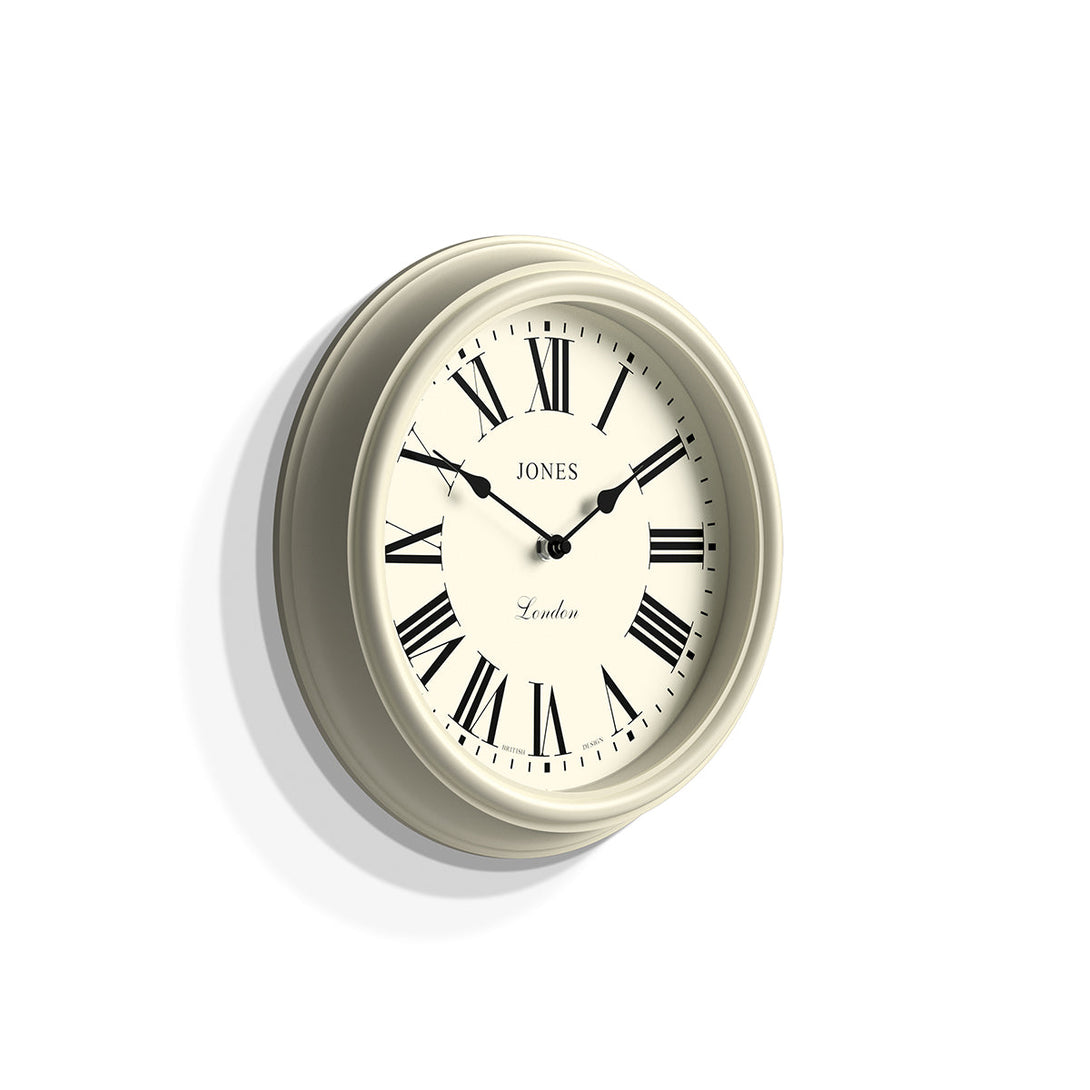Skew - Venetian wall clock by Jones Clocks. A classic Roman numeral dial with traditional spade hands, inside a decorative cream case - JVEN319LW