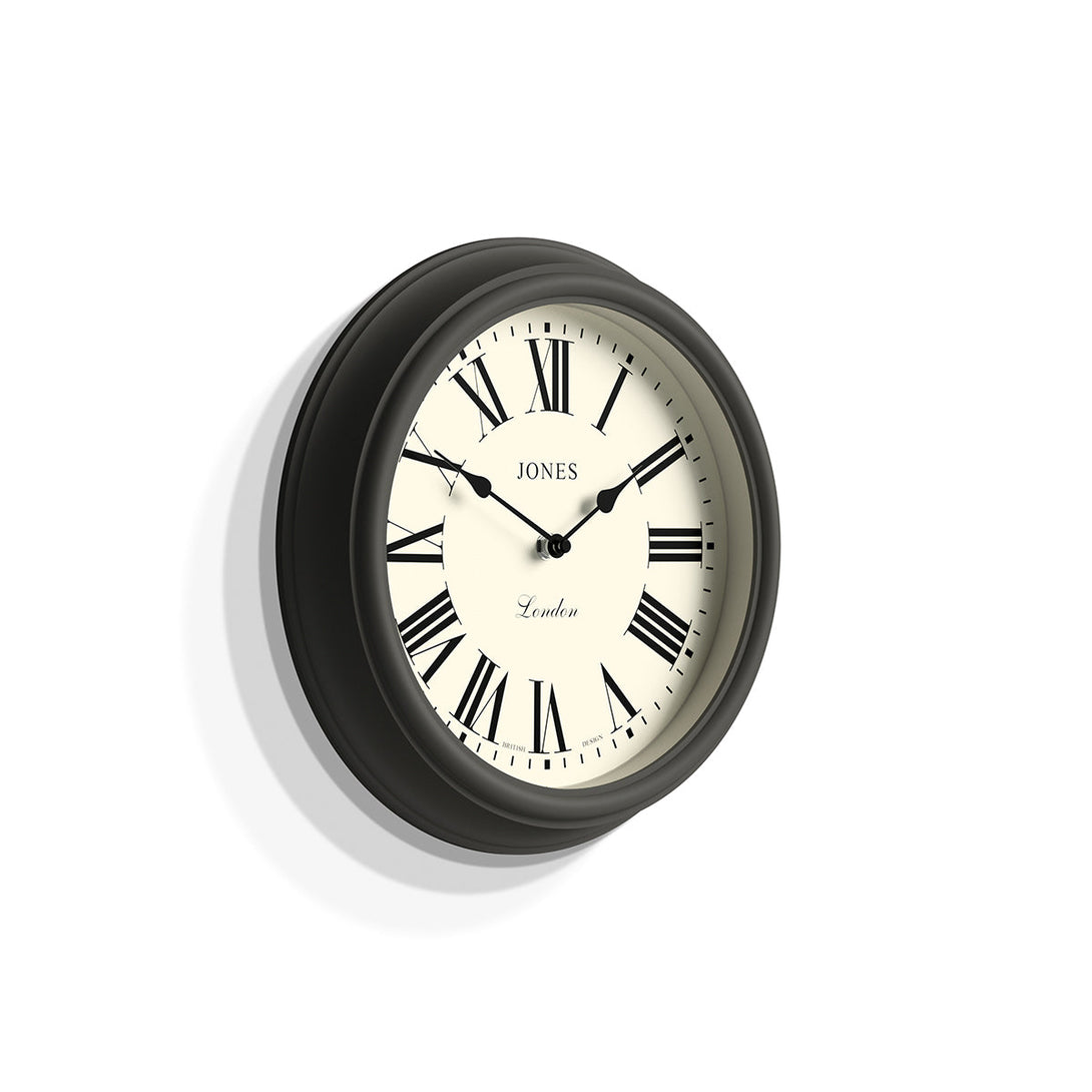 Skew - Venetian wall clock by Jones Clocks. A classic Roman numeral dial with traditional spade hands, inside a decorative blizzard grey case - JVEN319BGY