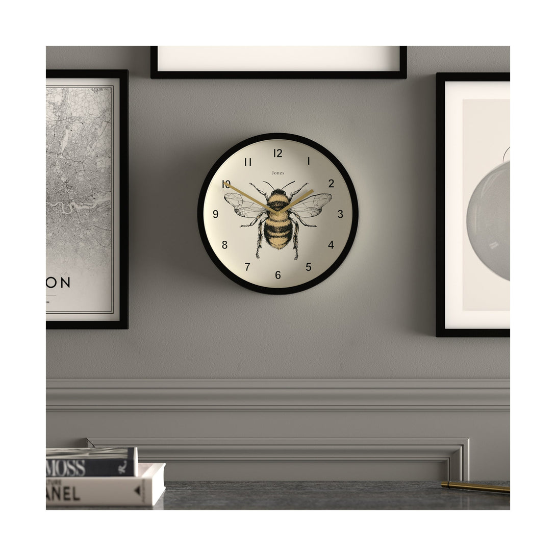 Bee wall clock by Jones Clocks with a black case and modern bee dial - JDRAG277K