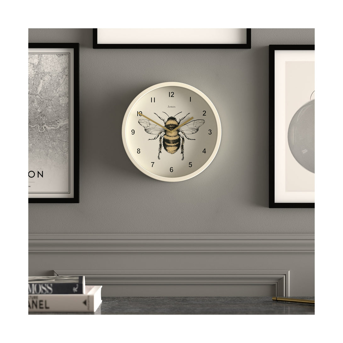 Bee wall clock by Jones Clocks with a linen white case and modern bee dial - JDRAG277LW