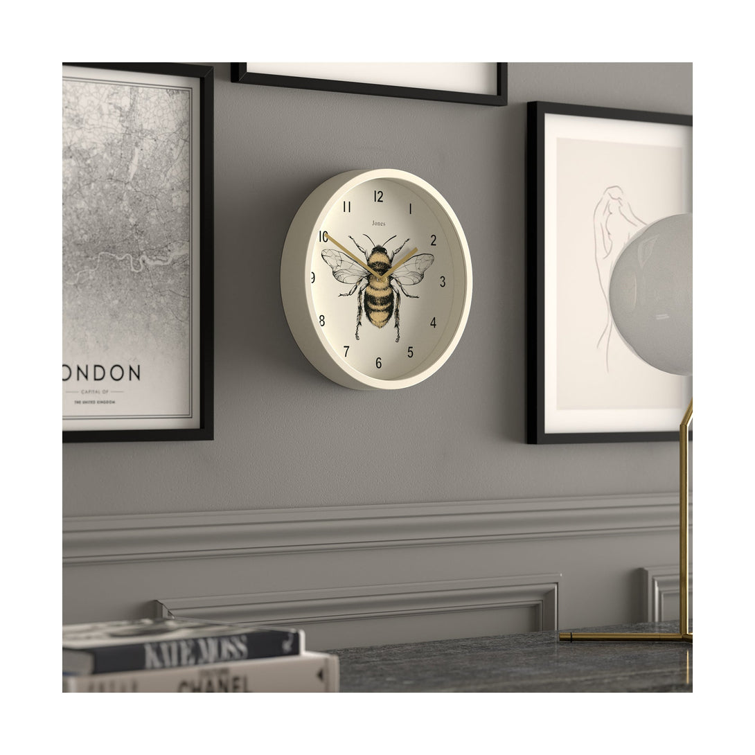 Bee wall clock by Jones Clocks with a linen white case and modern bee dial - JDRAG277LW