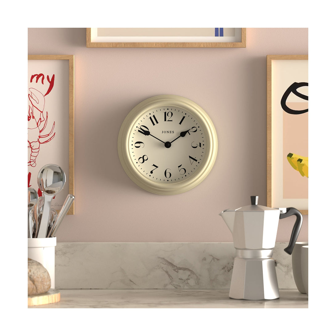 Frieze wall clock by Jones Clocks in cream with classic Arabic dial and spade hands - JFRZ111C