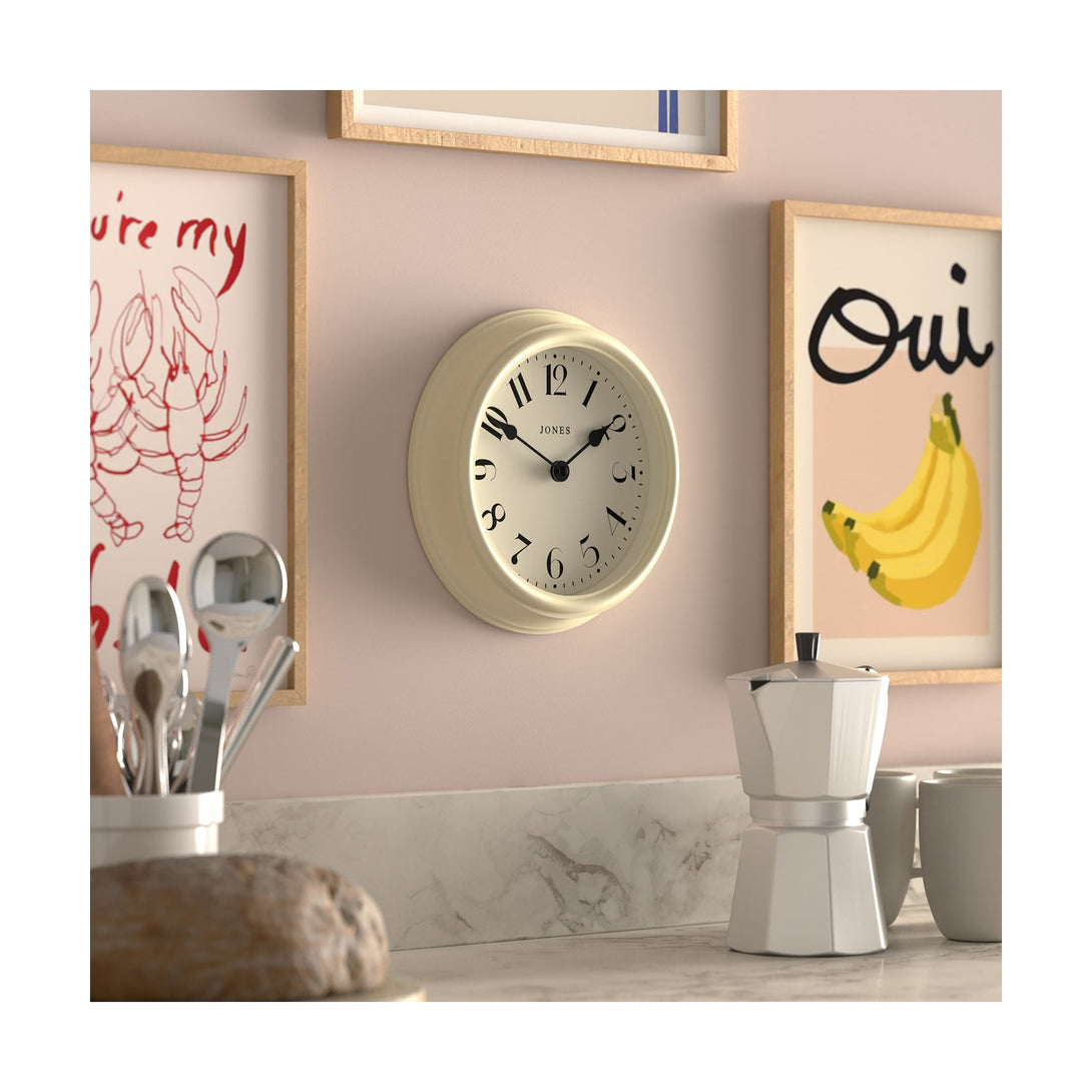 Frieze wall clock by Jones Clocks in cream with classic Arabic dial and spade hands - JFRZ111C