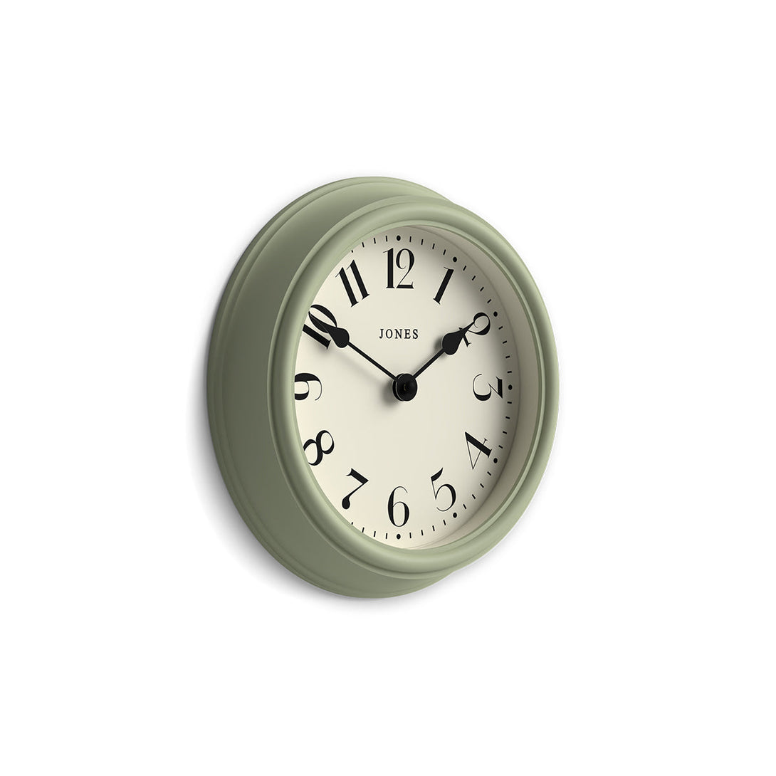 Side view - Frieze wall clock by Jones Clocks in sage green with classic Arabic dial and spade hands - JFRZ111DS