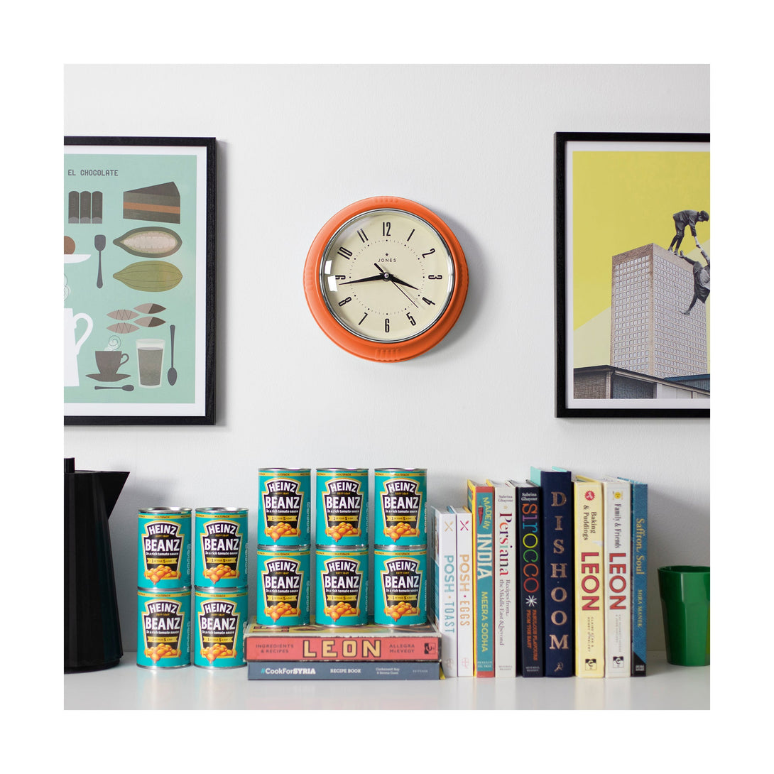 Ketchup retro wall clock by Jones Clocks in pumpkin orange with vintage-influenced dial, in a kitchen setting - JKETC214PO