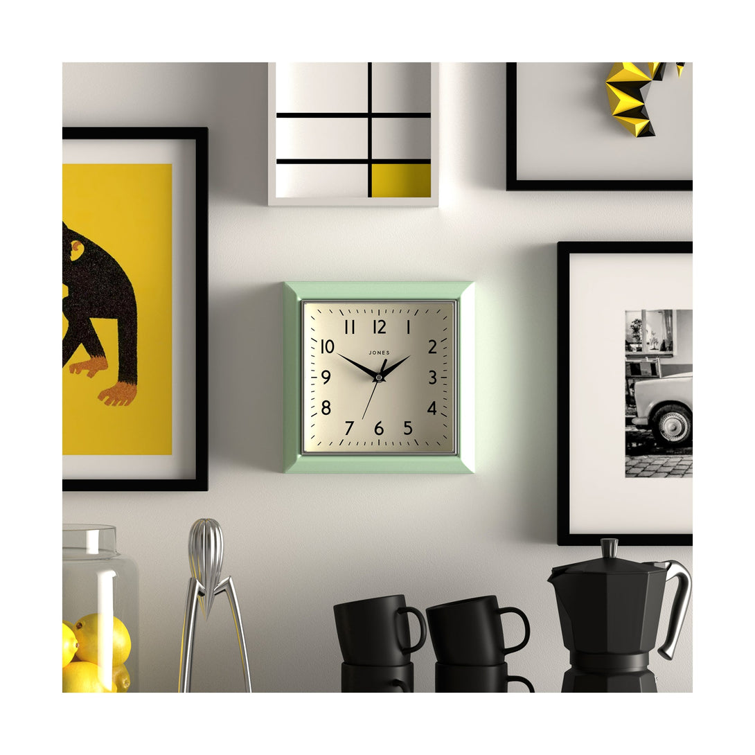 Style shot - Mustard wall clock by Jones Clocks in mint green with a square retro style case and a contemporary dial - JMUST741NM