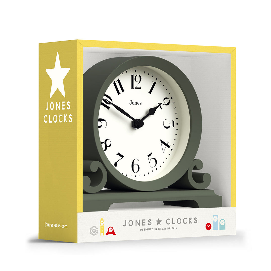 Packaging - Saloon decorative mantel clock by Jones Clocks in moss green with a modern stylistic Arabic dial and metal spade hands - JSAL192ASG