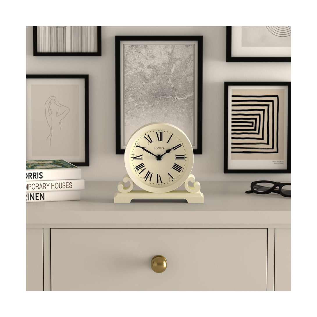 Style shot - Saloon decorative mantel clock by Jones Clocks in white linen with a modern stylistic Roman numeral dial and metal spade hands - JSAL319LW