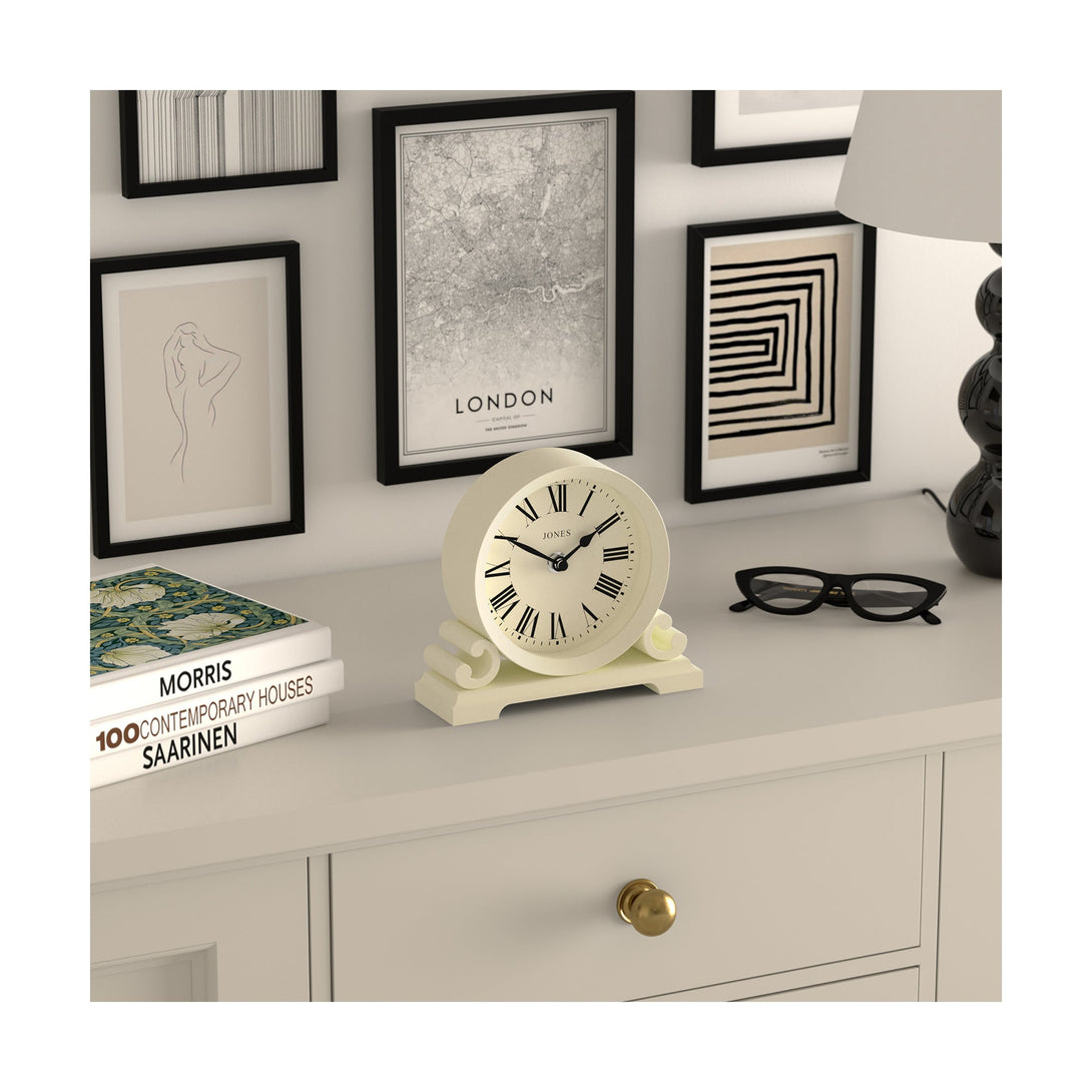 Skew style shot - Saloon decorative mantel clock by Jones Clocks in white linen with a modern stylistic Roman numeral dial and metal spade hands - JSAL319LW