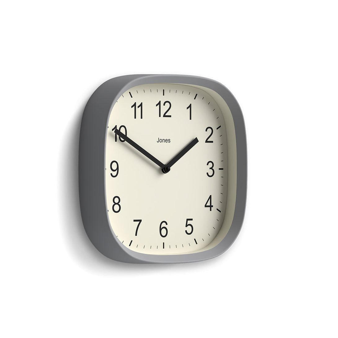 Skew - Sprite wall clock By Jones Clocks with a rounded square case in a pale grey. Clear contemporary Arabic dial - JSPARV104CGY