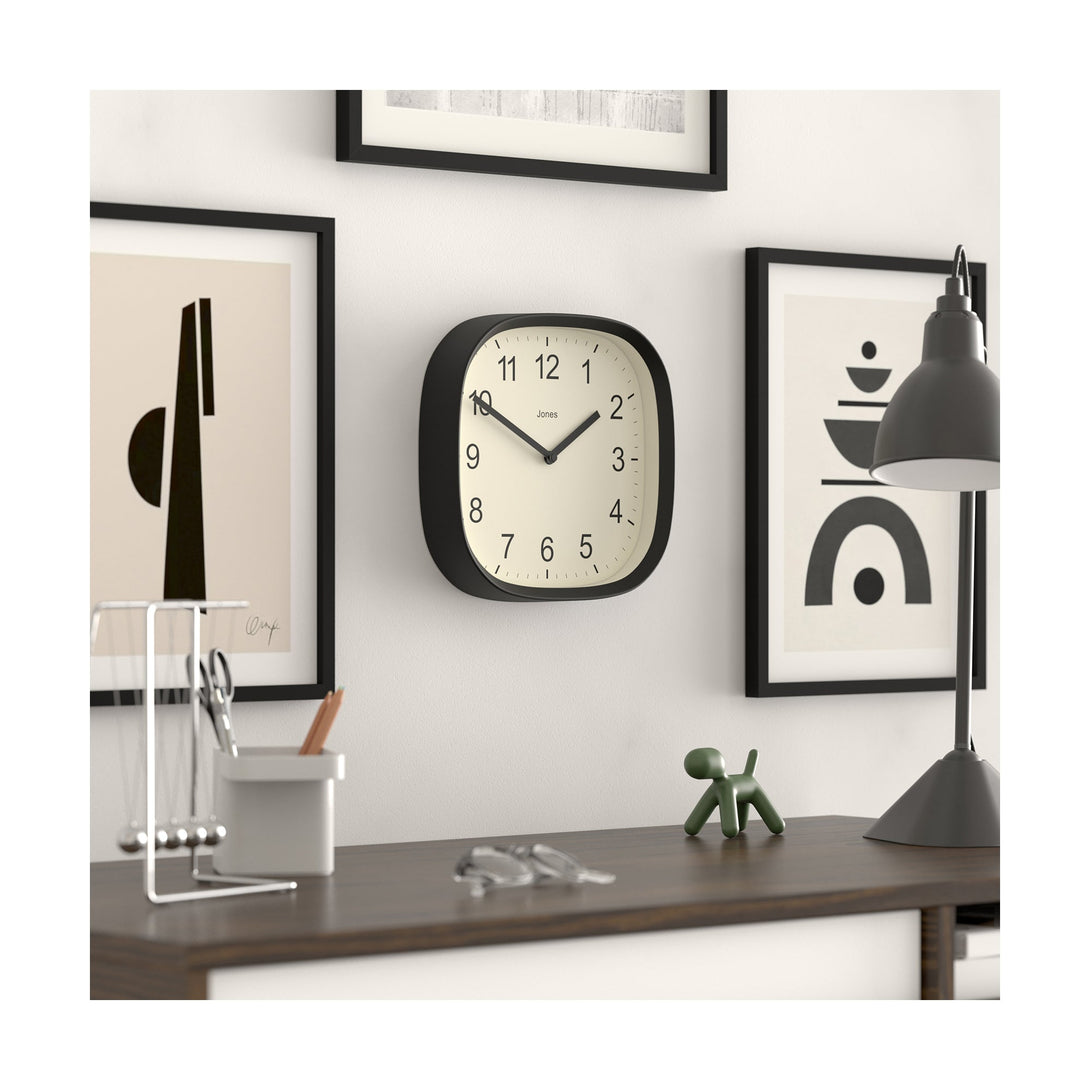 Skew office - Sprite wall clock By Jones Clocks with a rounded square case in a black. Clear contemporary Arabic dial - JSPARV104K