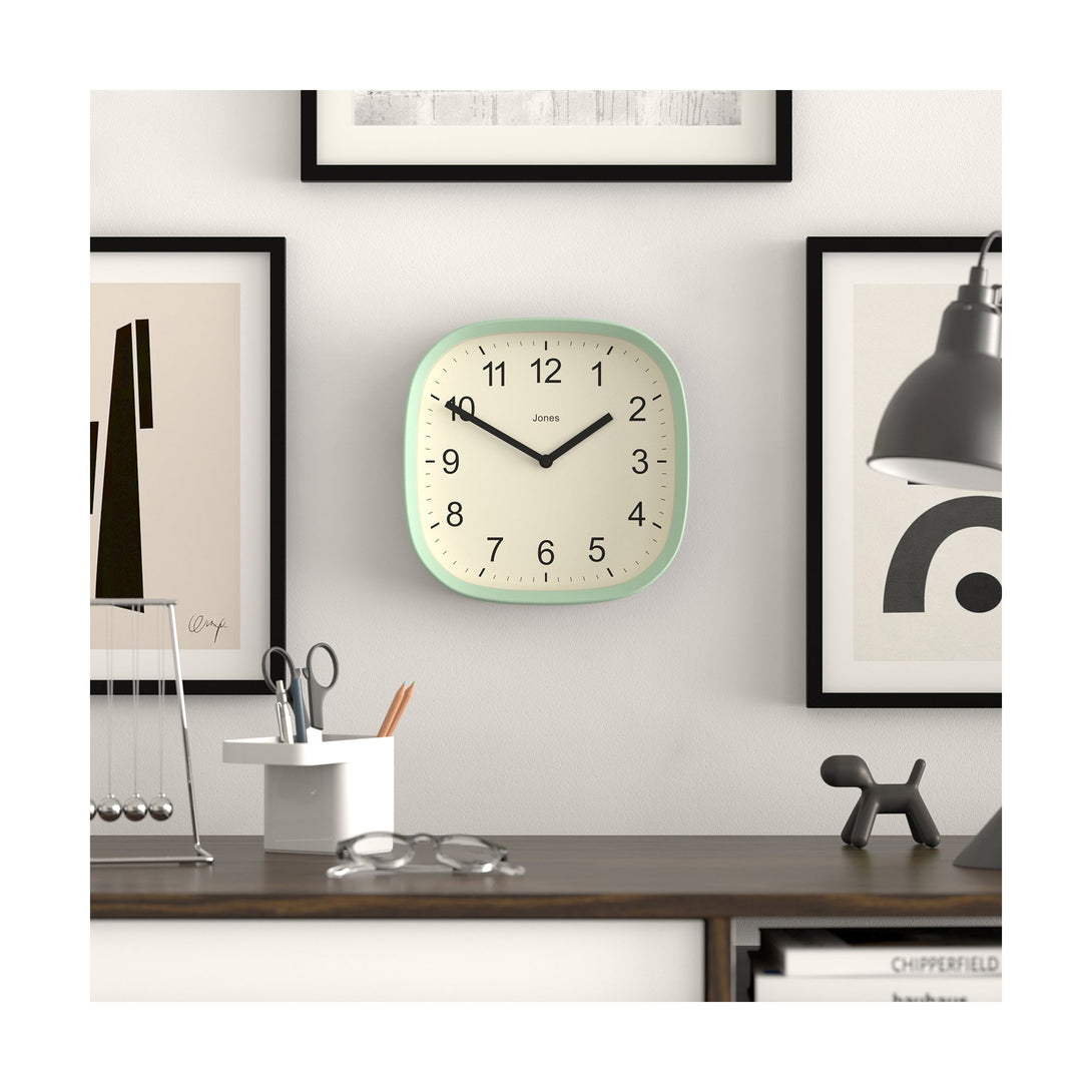 Office wall - Sprite wall clock By Jones Clocks with a rounded square case in a mint green. Clear contemporary Arabic dial - JSPARV104NM