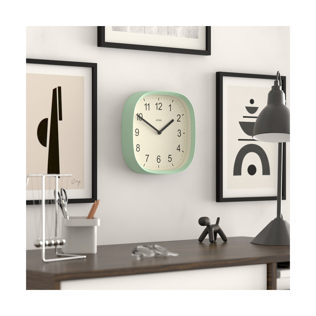 Skew office - Sprite wall clock By Jones Clocks with a rounded square case in a mint green. Clear contemporary Arabic dial - JSPARV104NM