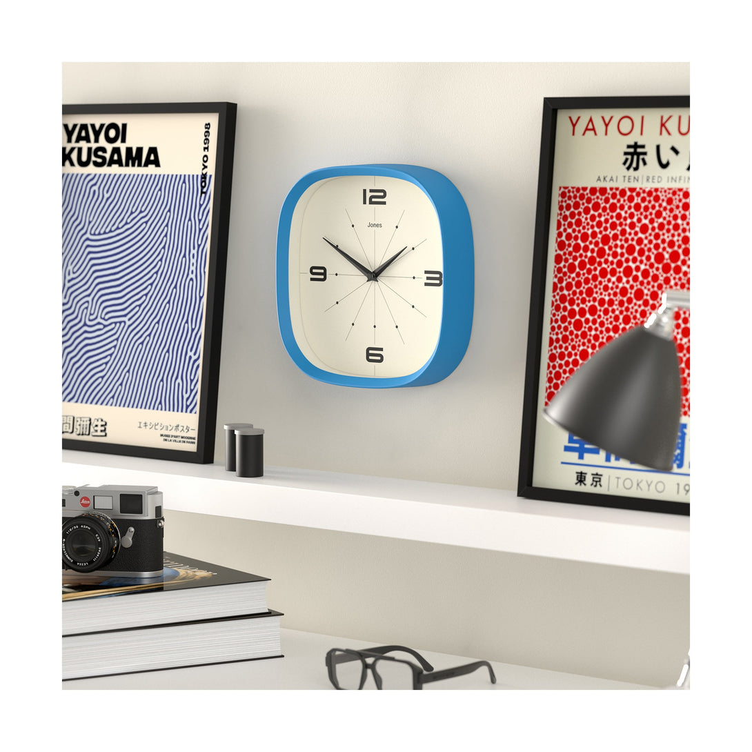 Living room skew - Pulsar wall clock By Jones Clocks with a rounded square case in Mid Blue. Retro-inspired simplified dial - JSPARV179MBL