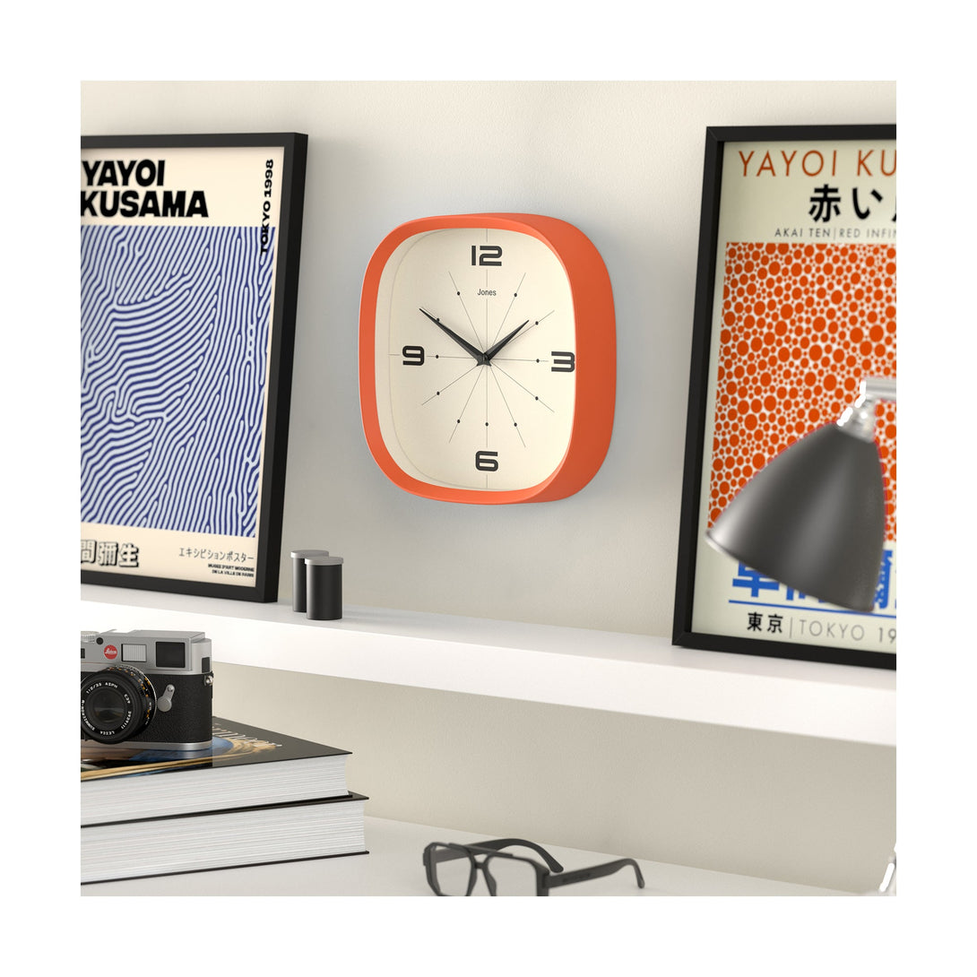 Living room skew - Pulsar wall clock By Jones Clocks with a rounded square case in Pumpkin Orange. Retro-inspired simplified dial - JSPARV179PO