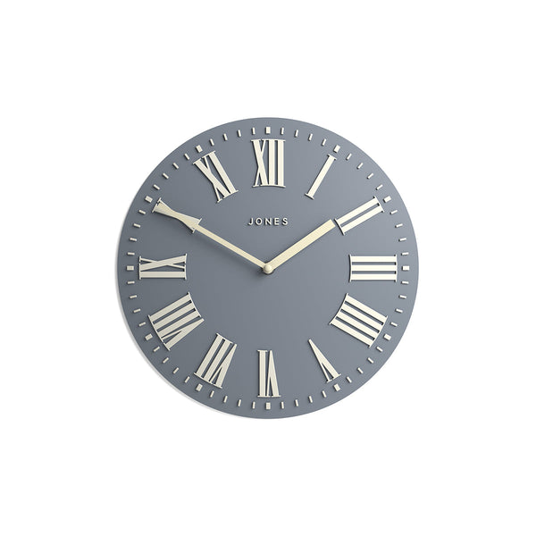 Front - Strand convex wall clock by Jones Clocks. Prominent white Roman duals on a medium blue grey background, offering a modern look - JSTRFNLW30