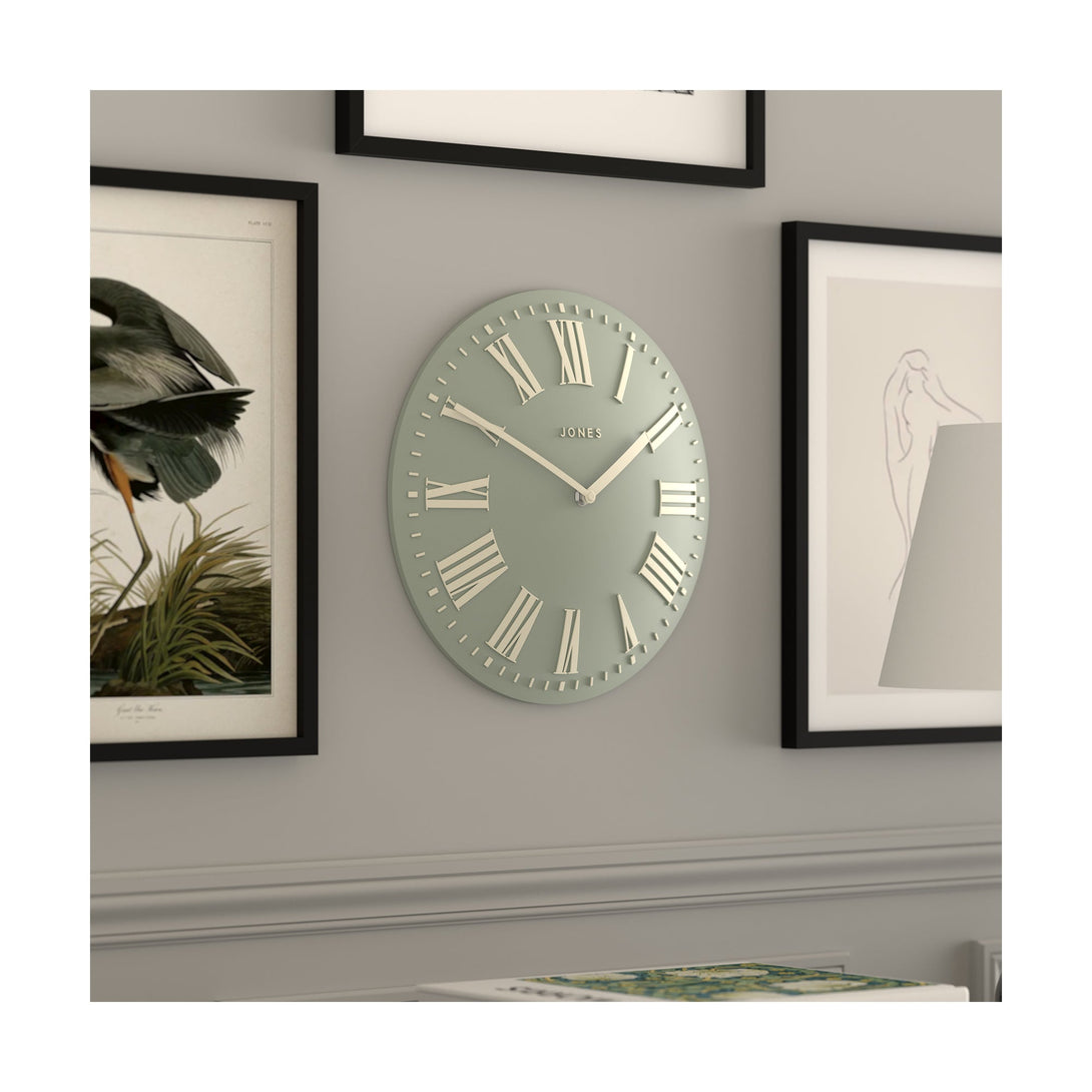 Living room skew - Strand convex wall clock by Jones Clocks. Prominent white Roman duals on a sage green background, offering a modern look - JSTRSGLW30