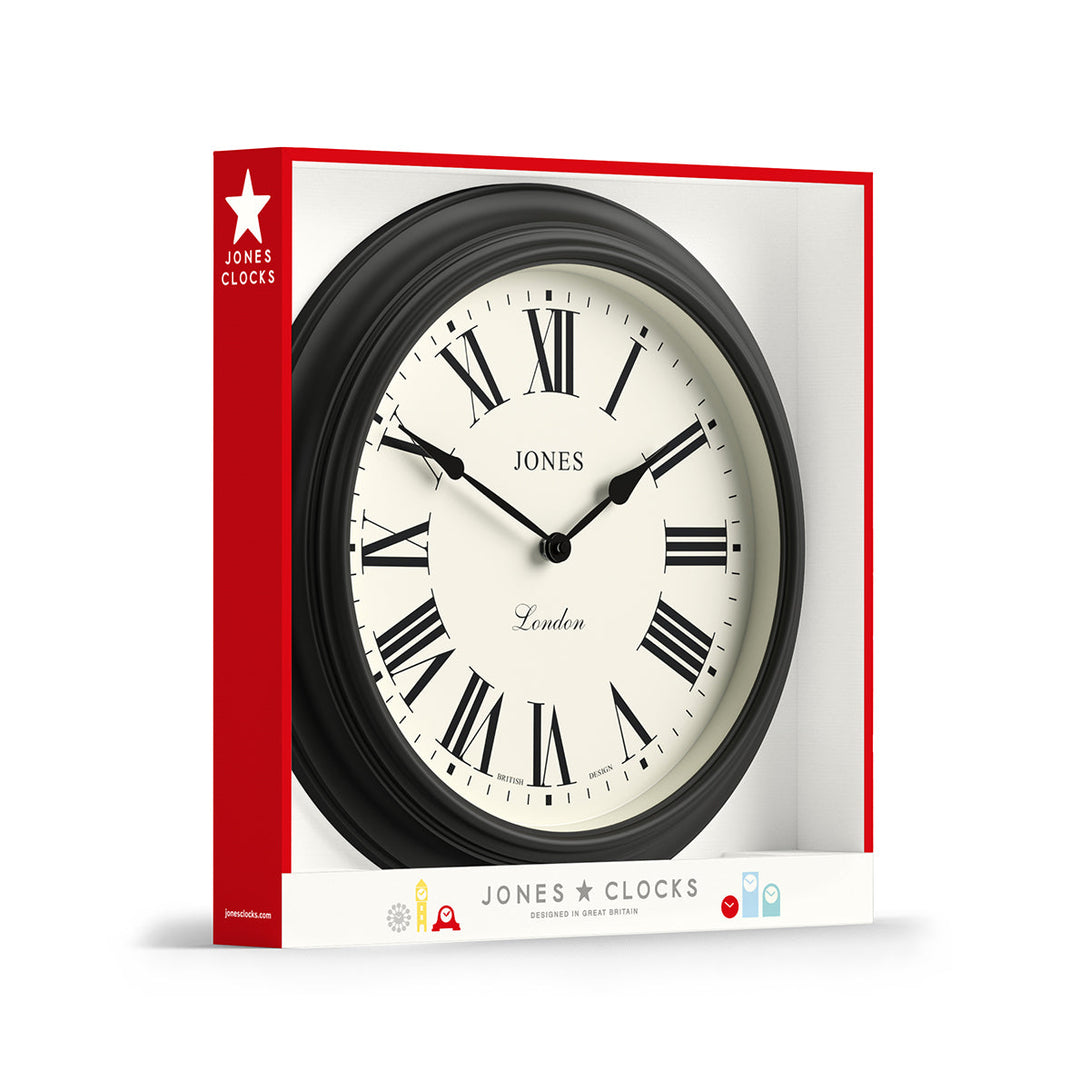 Packaging - Large Supper Club wall clock by Jones Clocks. A classic Dark Grey case with a Roman Numeral dial and black spade hands - JSUP319GGY