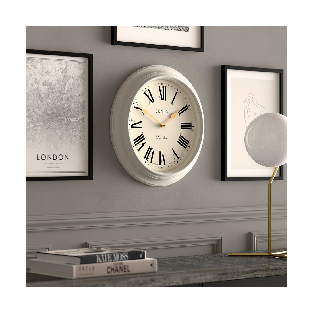 Gallery wall skew - Large Supper Club wall clock by Jones Clocks. A classic powder grey case with a Roman Numeral dial and 'gold effect' spade hands - JSUP319LGYII