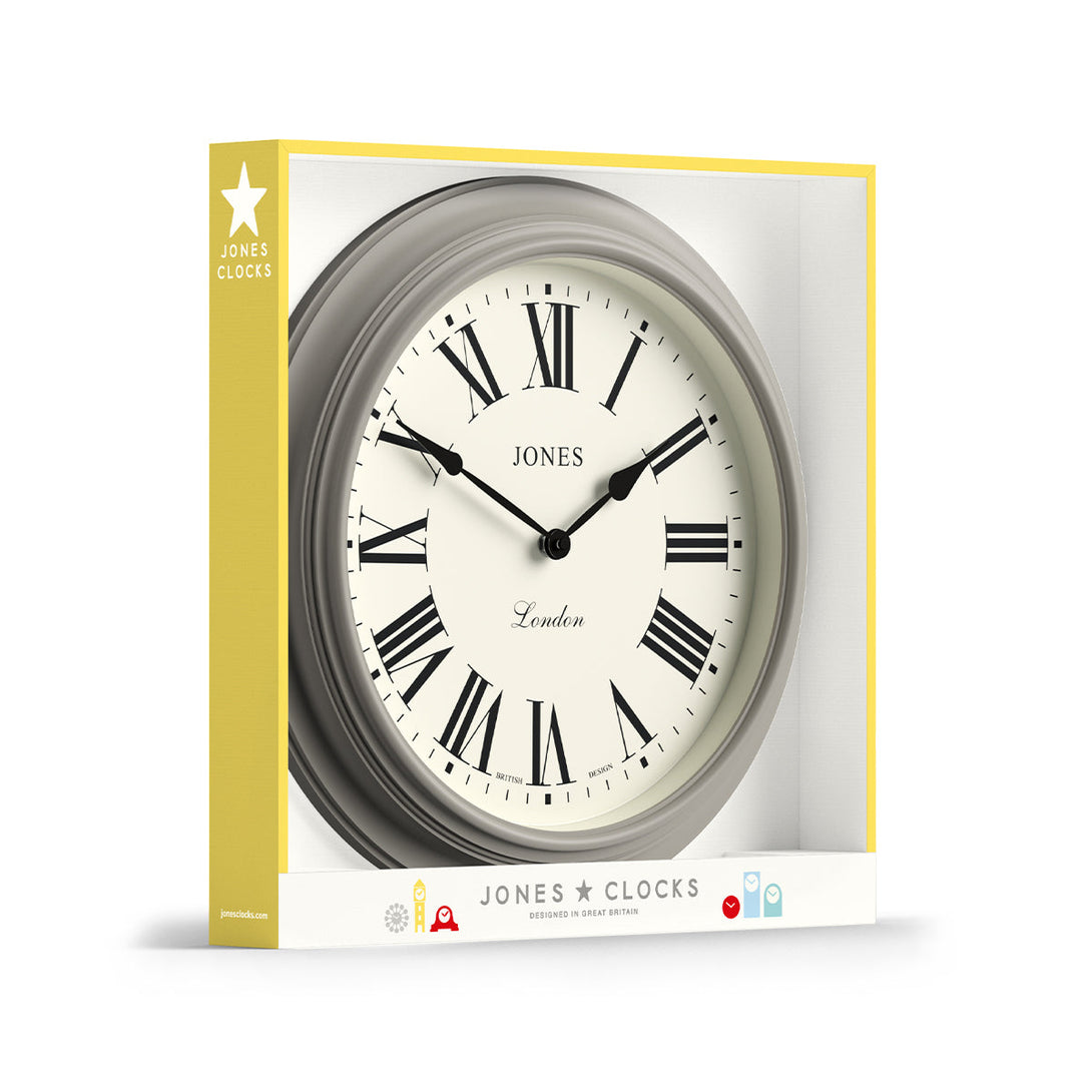 Packaging - Large Supper Club wall clock by Jones Clocks. A classic grey case with a Roman Numeral dial and black spade hands - JSUP319PGY
