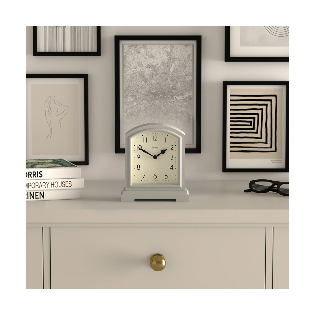 Style shot - Tavern mantel clock by Jones Clocks. A classic light grey case with an Arabic Numeral dial and black spade hands - JTAV243OGY