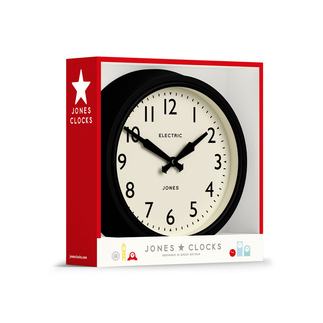 Packaging - Telecom wall clock by Jones Clocks. A mid-century modern black case, bold Arabic dial, and retro propelling hands - JTCOM27K