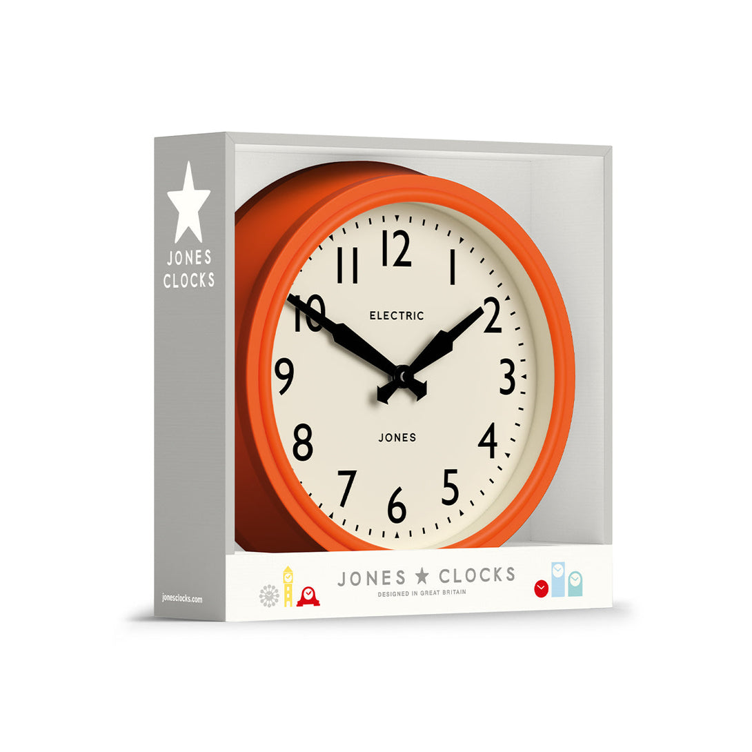 Packaging - Telecom wall clock by Jones Clocks. A mid-century modern orange case, bold Arabic dial, and retro propelling hands - JTCOM27PO