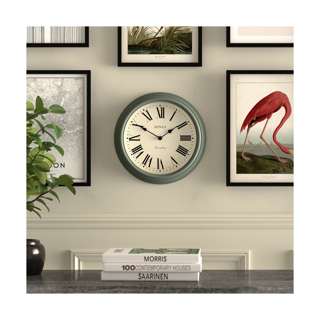 Gallery wall - Venetian wall clock by Jones Clocks. A classic Roman numeral dial with traditional spade hands, inside a decorative moss green case - JVEN319ASG