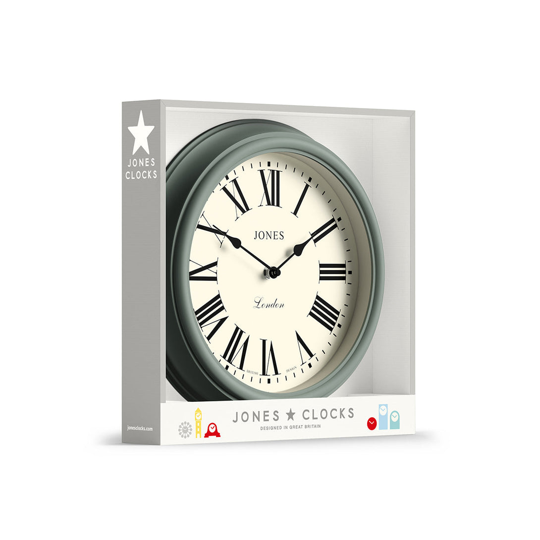 Packaging - Venetian wall clock by Jones Clocks. A classic Roman numeral dial with traditional spade hands, inside a decorative moss green case - JVEN319ASG