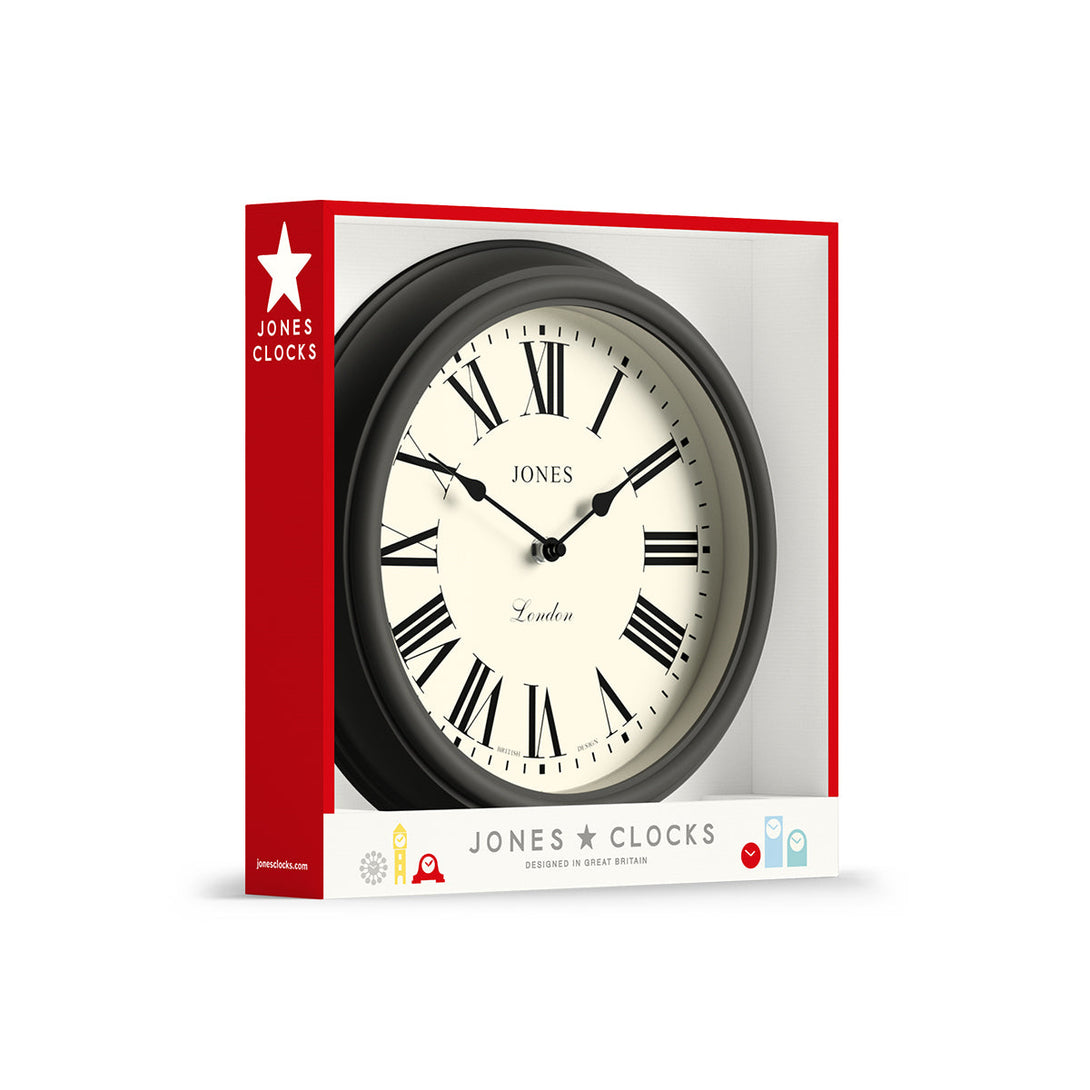 Packaging - Venetian wall clock by Jones Clocks. A classic Roman numeral dial with traditional spade hands, inside a decorative blizzard grey case - JVEN319BGY