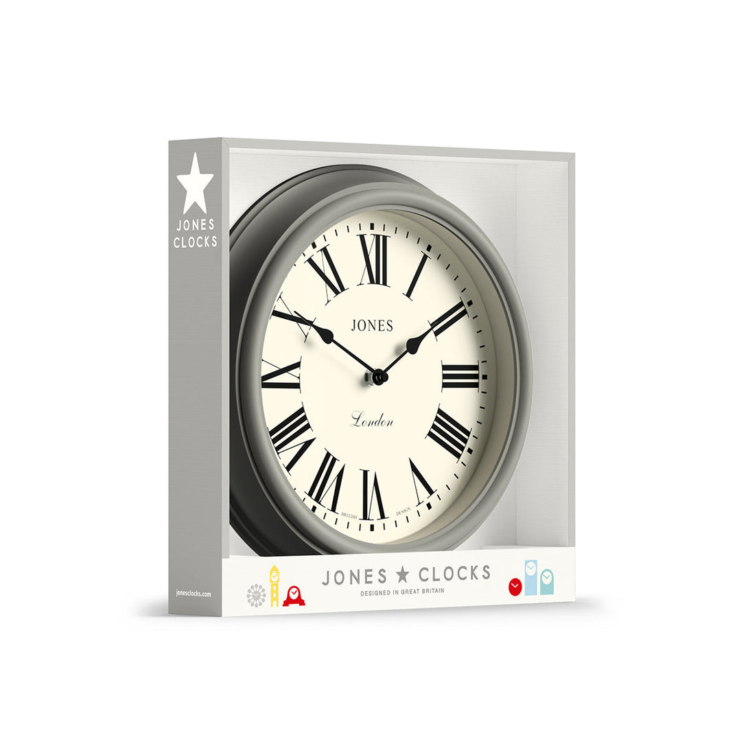 Packaging - Venetian wall clock by Jones Clocks. A classic Roman numeral dial with traditional spade hands, inside a decorative pepper grey case - JVEN319PGY
