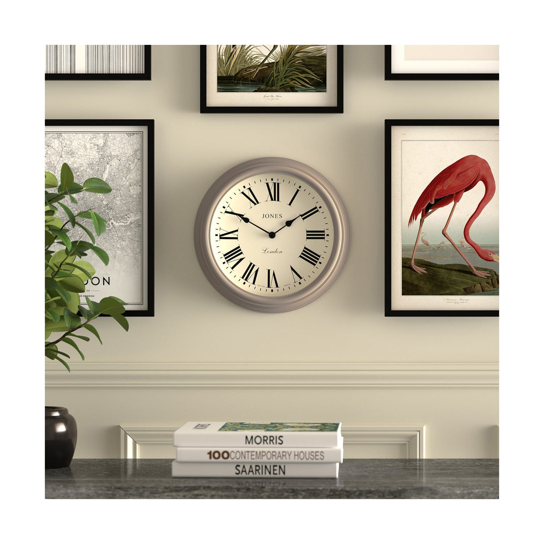Gallery wall - Venetian wall clock by Jones Clocks. A classic Roman numeral dial with traditional spade hands, inside a decorative 'mole grey' beige case - JVEN319ST
