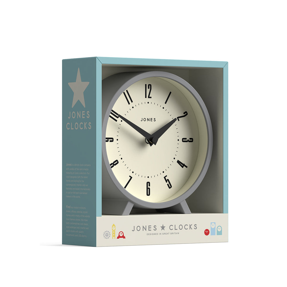 Packaging - Venus mantel clock by Jones Clocks. A contemporary mantel or desk clock in a grey case with triangulation hands, with a retro Arabic dial - JVNU214CGY
