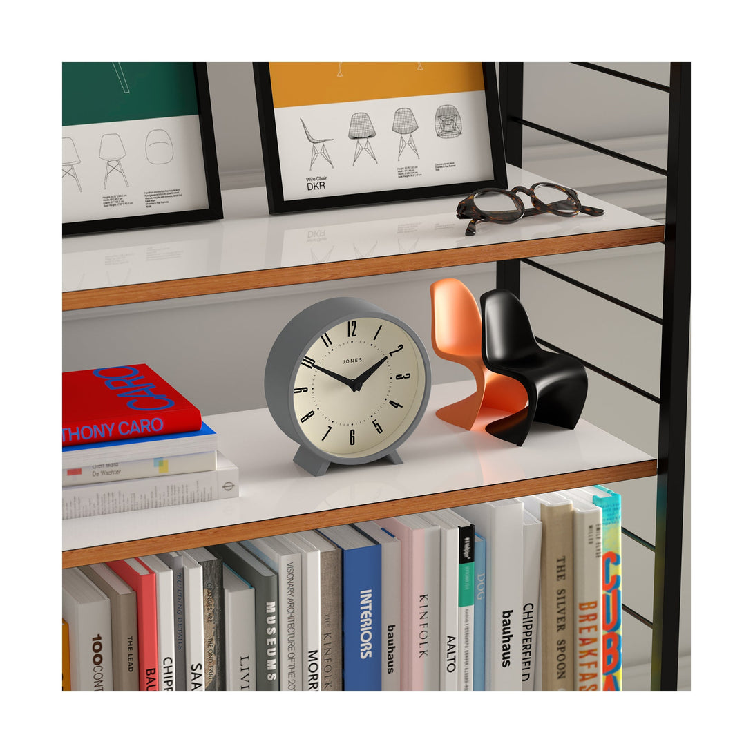 Shelving skew - Venus mantel clock by Jones Clocks. A contemporary mantel or desk clock in a grey case with triangulation hands, with a retro Arabic dial - JVNU214CGY