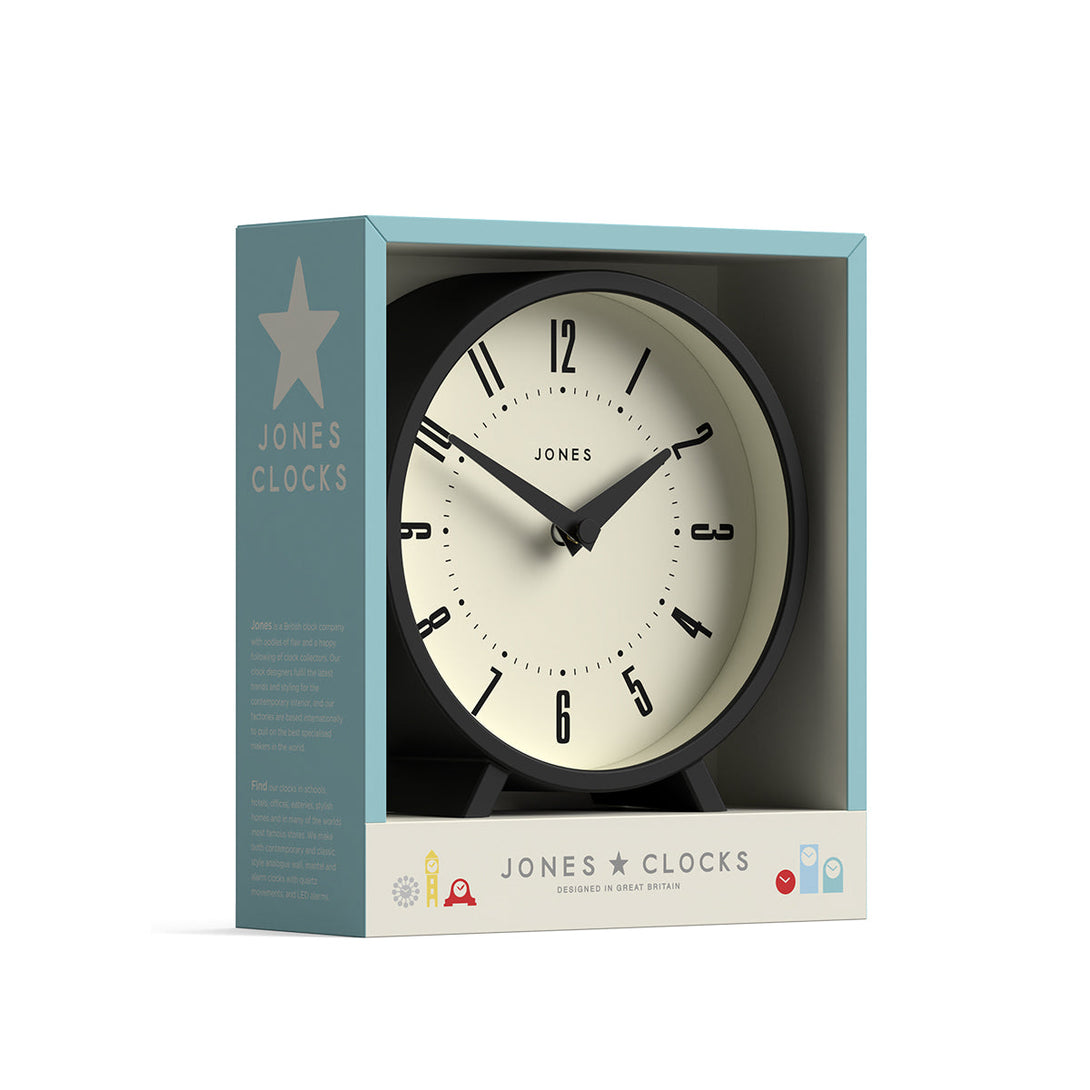 Packaging - Venus mantel clock by Jones Clocks. A contemporary mantel or desk clock in a black case with triangulation hands, with a retro Arabic dial - JVNU214K