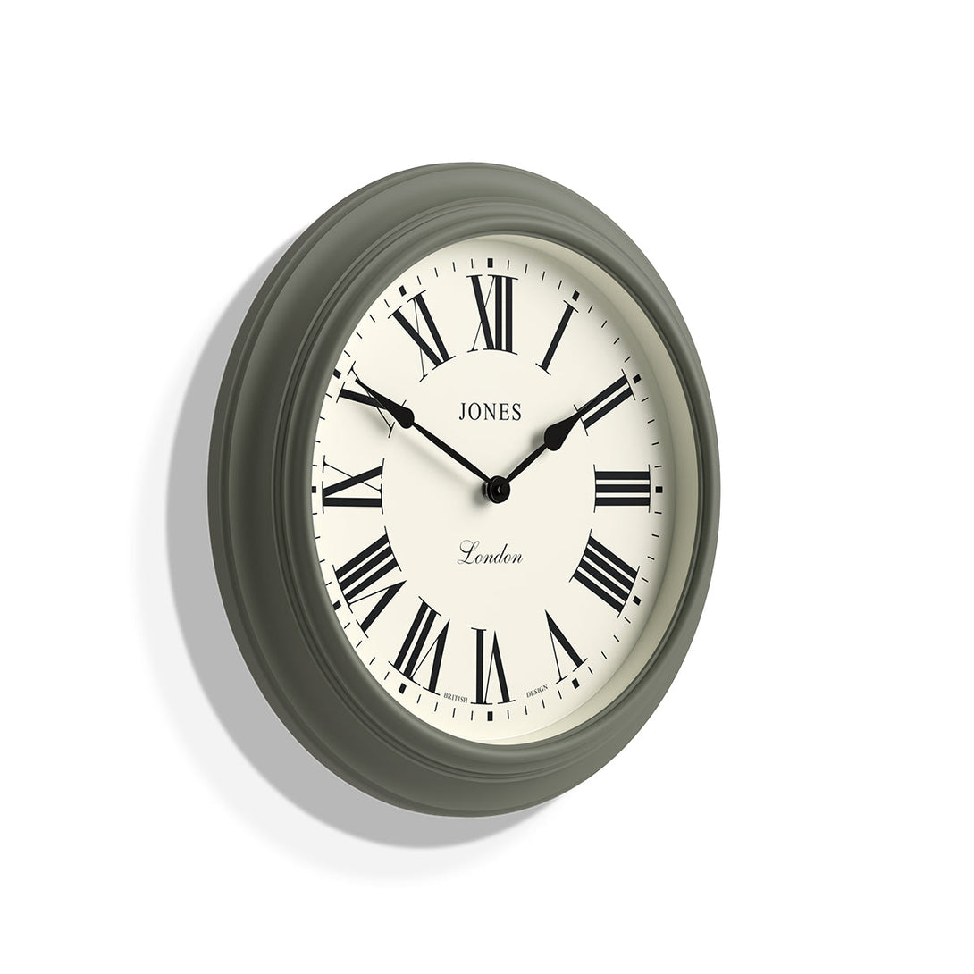 Skew - Large Supper Club wall clock by Jones Clocks. A classic Moss Green case with a Roman Numeral dial and black spade hands - JSUP319ASG