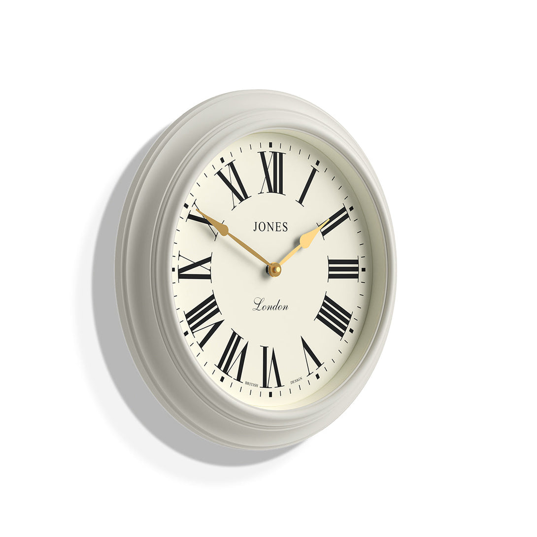 Skew - Large Supper Club wall clock by Jones Clocks. A classic powder grey case with a Roman Numeral dial and 'gold effect' spade hands - JSUP319LGYII