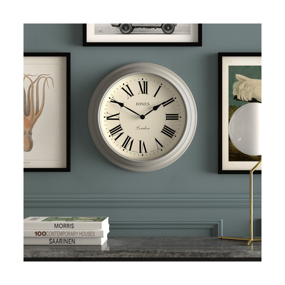 Gallery wall - Large Supper Club wall clock by Jones Clocks. A classic grey case with a Roman Numeral dial and black spade hands - JSUP319PGY