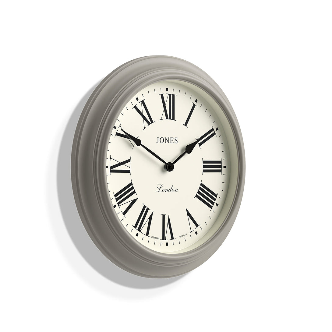 Skew - Large Supper Club wall clock by Jones Clocks. A classic grey case with a Roman Numeral dial and black spade hands - JSUP319PGY