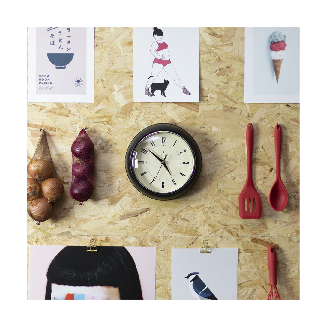 Ketchup retro wall clock by Jones Clocks in black with vintage-influenced dial, hanging on a kitchen wall - JKETC214K