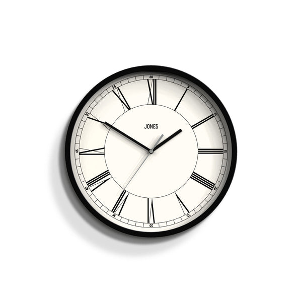 Front - Spartacus wall clock by Jones Clocks in black with a minimalist Roman numeral dial - JSPAR359K