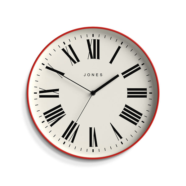 Front view - Magazine wall clock by Jones Clocks in a red case with a minimalist Roman numeral dial - JMAG444ER