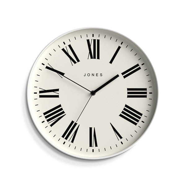 Front view - Magazine wall clock by Jones Clocks in a white case with a minimalist Roman numeral dial - JMAG444W