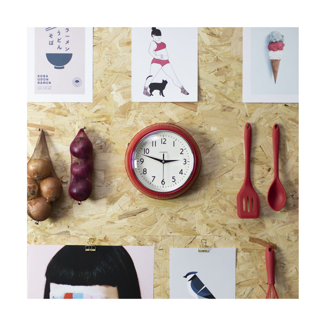 Ketchup retro wall clock by Jones Clocks in red with vintage-influenced dial, in a kitchen setting - JKETC223RArabic dial and triangular metal hands on a kitchen wall - JKETC223R