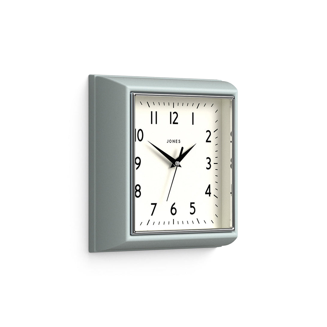 Skew - Mustard small square wall clock by Jones Clocks in Blue with an Arabic dial and metal hands - JMUST741CBL